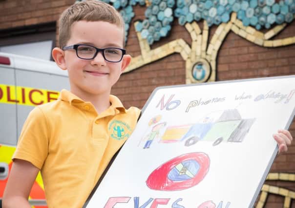(1 of 3) Winners of driver awareness poster competition - Pictured is Ashmead School's Harry Martin (7) PNL-190618-221324009