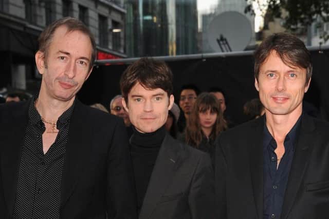 Mat Osman, Neil Codling and Brett Anderson in 2013. Picture: Getty