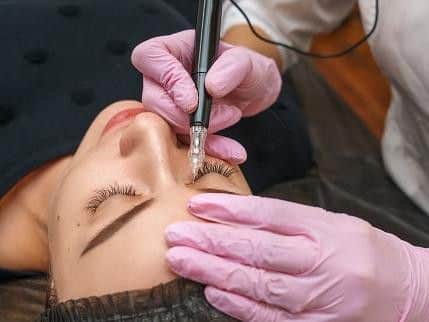 Library image of a microblading procedure taking place