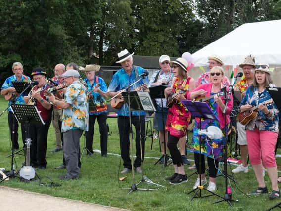 The Buckingham Ukelele Group performing as part of Winslow Concert Band's 25th anniversary party at Tomkins Park
