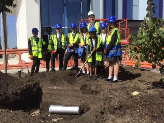 Burying a time capsule at the new St Michael's campus in Aylesbury