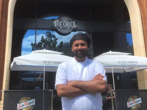 Usman Majid outside The Grill Steakhouse in Aylesbury town centre