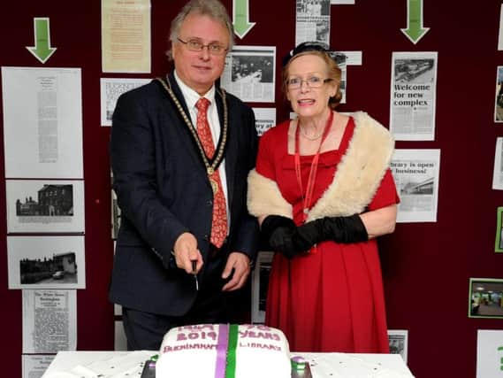 Buckingham councillor Jon Harvey along with library staff member Pam Scowen at the cake cutting