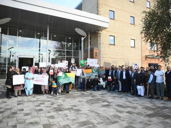 Protesters gathered outside the AVDC building this morning