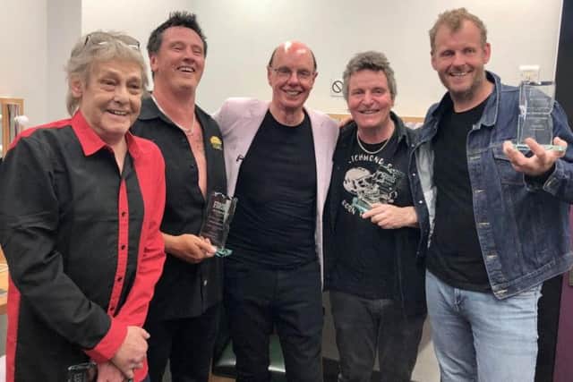 From left to right: Eddie and the Hot Rods Barrie Masters, Simon Bowley (drums), Richard Holgarth (guitar), Ian Dipster Dean (bass) with David Stopps