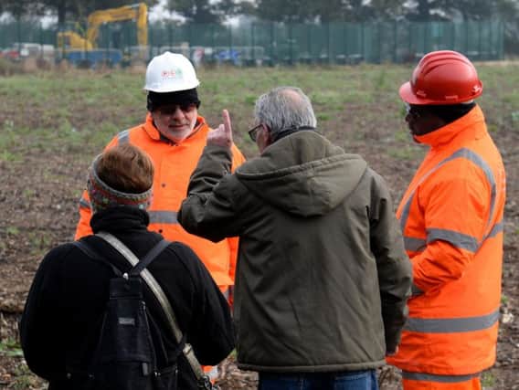 Cllr Frank Mahon challenges HS2 workers at the site just outside Steeple Claydon