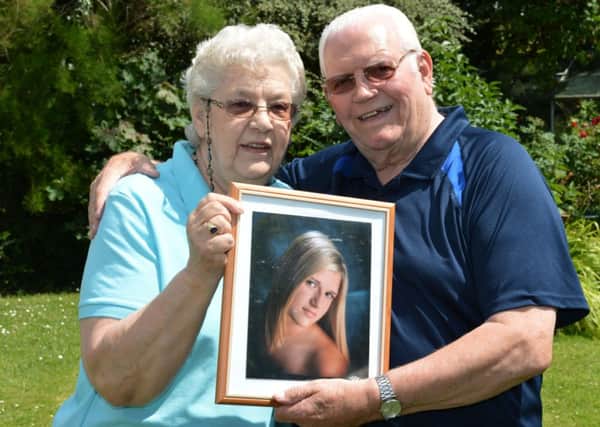 Kitty and Ray Phillips from Winslow with a picture of their daughter, Victoria who is coming home from Arkansas for her wedding