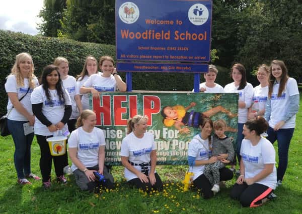 Supporters arrive at Woodfield School, Leverstock Green, after walking from Northchurch to raise funds  to improve the school therapy pool. Sarah Bedford is holding her daughter Ella, aged 4