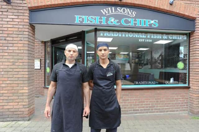 Boss of Wilsons Fish & Chips in Tring Shaban Azam (bandaged) with Omar Fathe PNL-140409-180303001