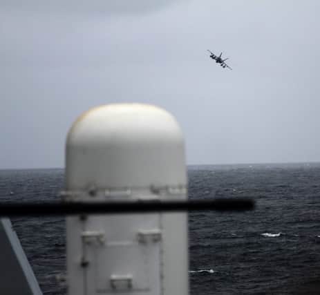 A F18 fighter takes off from an aircraft carrier