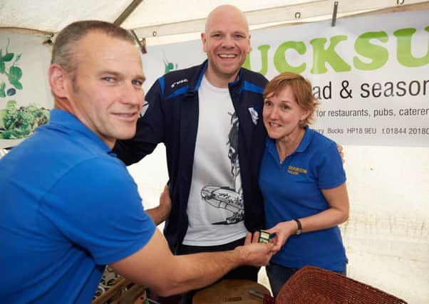 David Newman, left, with his fiance Tracy Russell, right, after he proposed at Thame Food Festival. Centre is top chef Tom Kerridge, one of David's regular customers
