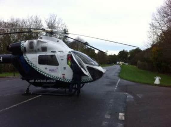 An air ambulance landing outside Mentmore Golf Club after an accident on the road between Mentmore and Cheddington