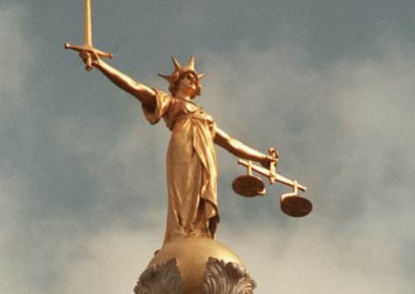 The Scales of Justice on top of the Old Bailey in London