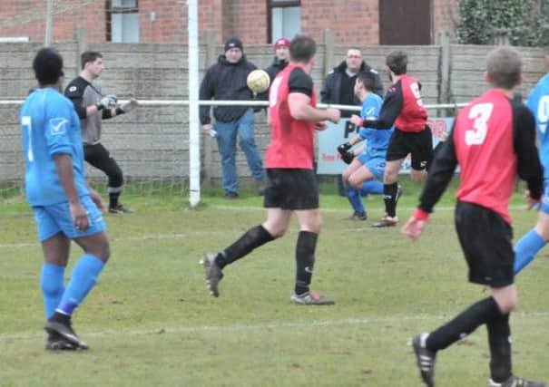 Tring number 3 Stuart Stedman crosses for Chris Vardy to glance home for 2-0. Picture (c) Colin Sturges
