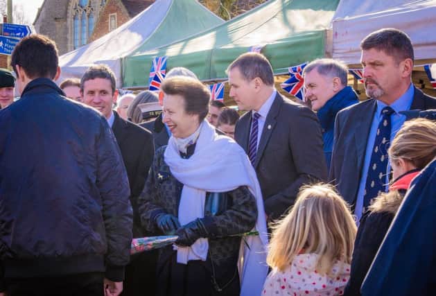 HRH Princess Anne meets crowds in Thame and below unveils a plaque in the town centre