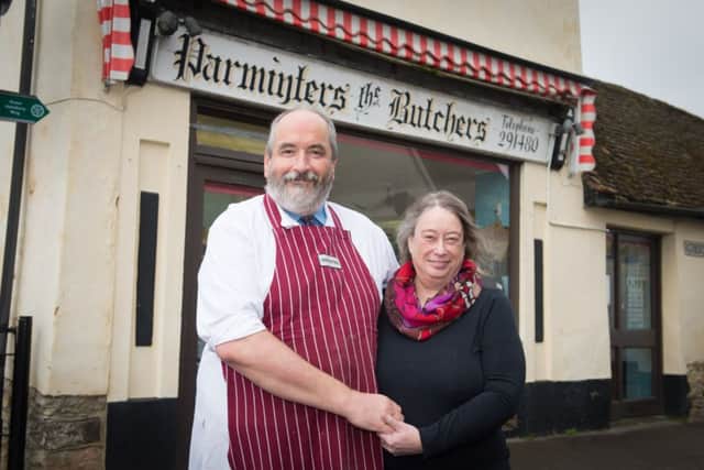 Butcher Simon Parminter - who is retiring - pictured at his shop in Haddenham - pictured with his wife Margot PNL-150316-162809009