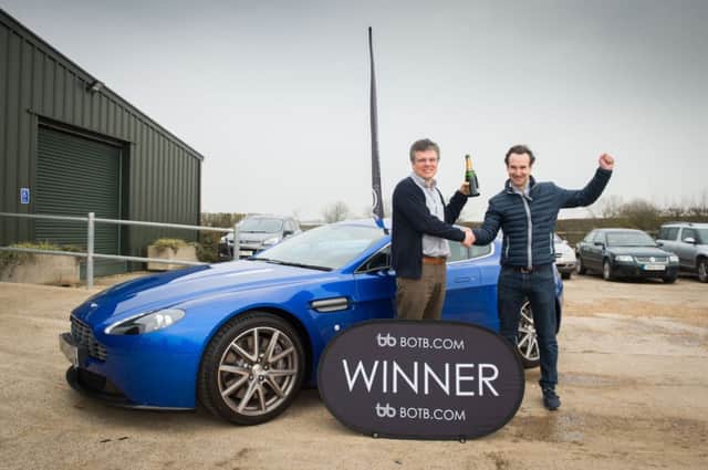 Charles Wemyss wins an Aston Martin - pictured here being surprised with his win at his work place at Granborough - Will Hindmarch from botb.com handed over the keys