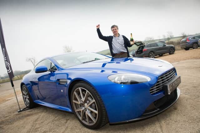 Charles Wemyss wins an Aston Martin - pictured here being surprised with his win at his work place at Granborough - Will Hindmarch from botb.com handed over the keys