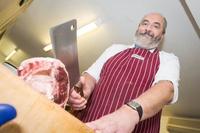 Butcher Simon Parminter - who is retiring - pictured at his shop in Haddenham