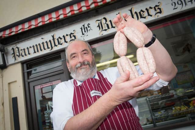 Butcher Simon Parminter - who is retiring - pictured at his shop in Haddenham PNL-150316-160524009