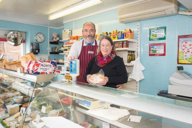 Butcher Simon Parminter - who is retiring - pictured at his shop in Haddenham - pictured with his wife Margot PNL-150316-161224009