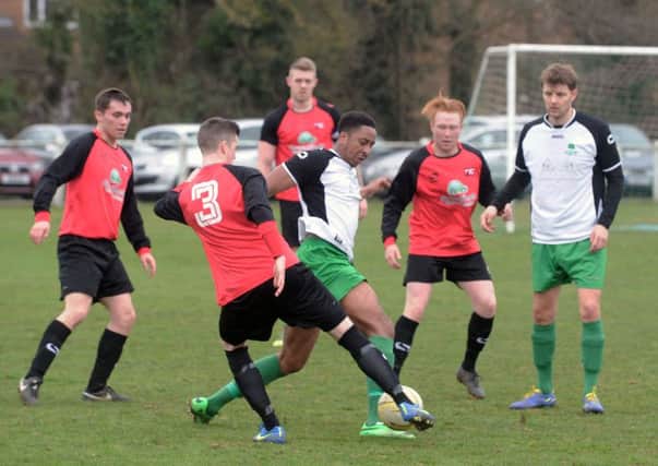 Leverstock Green's Nathan Jallow battles for possession