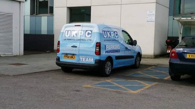 A UKPC vehicle parked in a disabled bay outside Stoke Mandeville National Spinal Injuries Centre