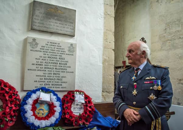Air Marshal Sir Colin Terry unveiling a memorial plaque in memory of the crew of a Wellington bomber that crashed in North Marston on January 4, 1945. PNL-150514-140532001