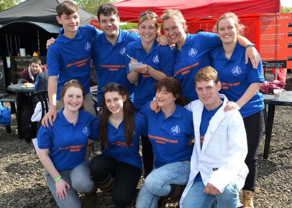 Bucks YFC annual rally and Milton Keynes Country Show at Spinney Lodge Farm, Hanslope. Princes Risborough Young Farmers just after completing their stock judging test.
