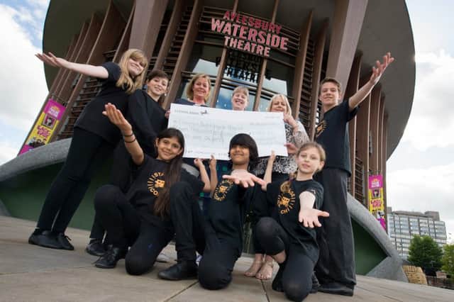 Stagecoach (Aylesbury and Thame) present a cheque from their show at Aylesbury Waterside Theatre to the Florence Nightingale Hospice Charity for over £11,000
