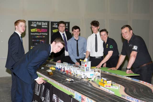 Students from Bucks UTC project manage a Scalextric event in conjunction with 3D Print World - pictured with some of the students are 3D Print worlds Sarah Dyckhoff and David Dilworth