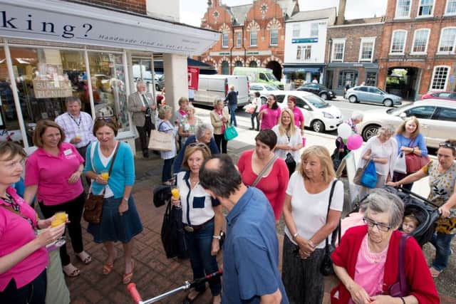 Opening of the Florence Nightingale Hospice Charity shop in Thame by Mayor of Thame, Cllr Nichola Dixon - pictured are the crowd entering the shop after the ribbon cutting