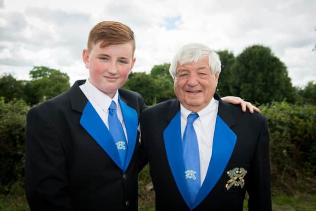 Marsh Gibbon silver band celebrates it's 150th anniversary - pictured are the oldest and youngest members of the band - Doug White and his grandson Finn Murphy