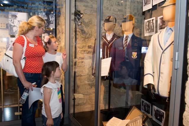 Pictured checking out the displays of the schools history are Liz Jones and her daughters Emily (5) and Maisie (10)