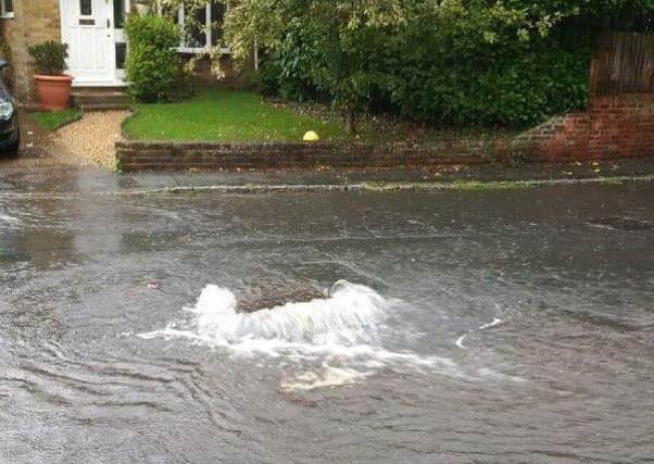 The manhole in Cheddington overflowed after heavy rain