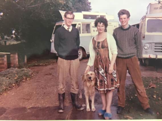Michael, Major and Julia Howe pictured with the old-style vans