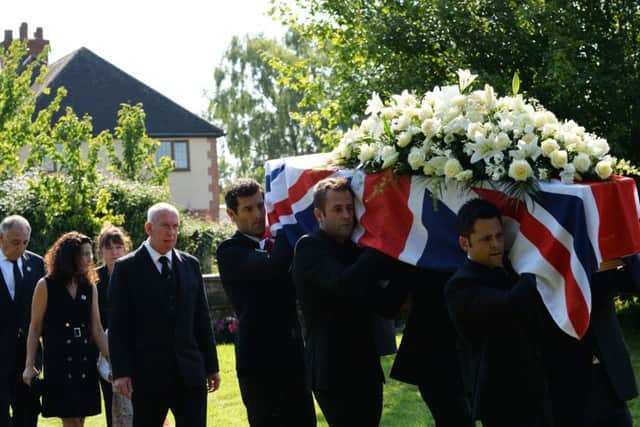 Former Formula 1 racer Mark Webber (centre) helps carry Justin Wilson's coffin at St. James the Great Church in Paulerspury