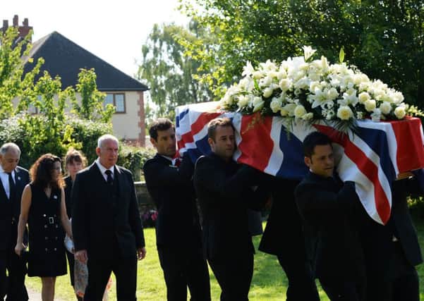 Former Formula 1 racer Mark Webber (centre) helps carry Justin Wilson's coffin at St. James the Great Church in Paulerspury