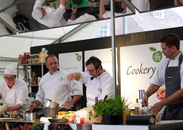 Action from a cookery demonstration at the Thame Food Festival in 2013