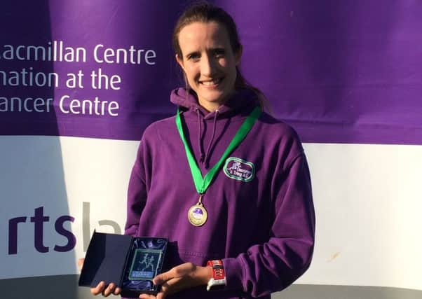 Dacorum & Tring's Victoria Thornley proudly displays her award for finishing third in the Moor Park 10k