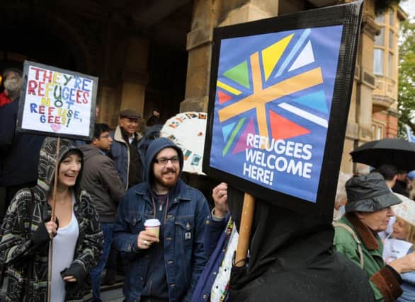 "Refugees are Welcome Here" protests have been held throughout the country. The one pictured here is from Leamington.