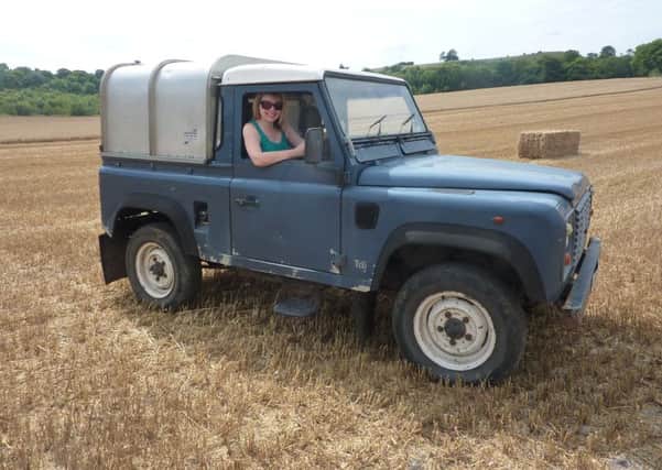 Farmer's wife Heather Jan Brunt driving the farm Land Rover