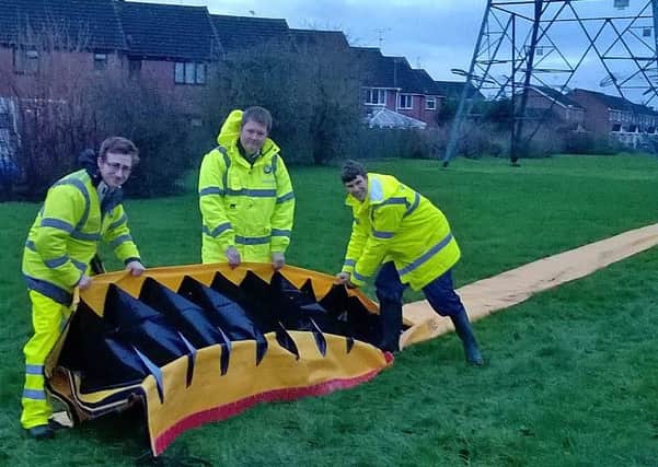 County councillor Steven Lambert (centre) with strategic flood management officers Andrew Waugh (left) and Alex Back