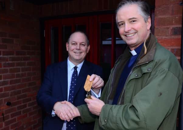 Cabinet Member John Chilver hands the former day centre keys to Rector Will Pearson-Gee