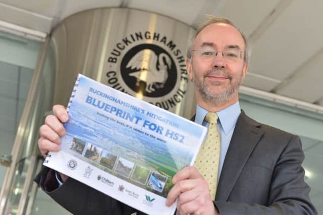 Martin Tett pictured in 2014 with the original document which set out mitigation demands in Bucks