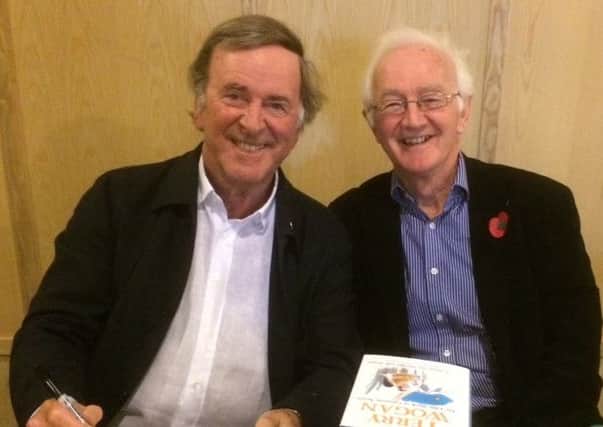 Sir Terry Wogan with the owner of The Book House Brian Pattinson during a book signing in Thame in November 2014