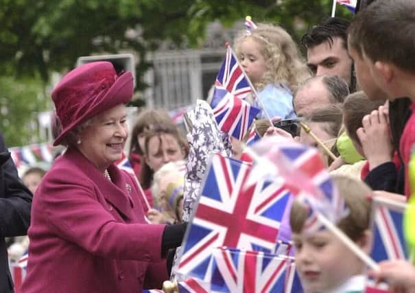 Queen Elizabeth II greets wellwishers in  Aylesbury town centre, Friday May 10, 2002.
