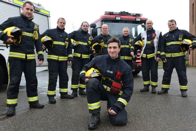 Firefighter James Ridley-Jones, a student at The Universitry of Buckingham with colleagues at Buckingham Fire Station