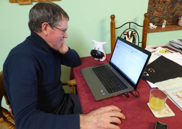 Farmer using his laptop