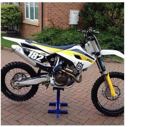 The white, blue and yellow 2015 Husqvarna FC250 was among items taken from the garage of a property in Midhurst Close